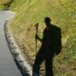 Shadow of hiker with selfie stick